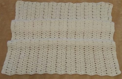 CD. Crocheted baby blanket.